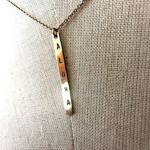 Gold tone aloha  bar pendant necklace